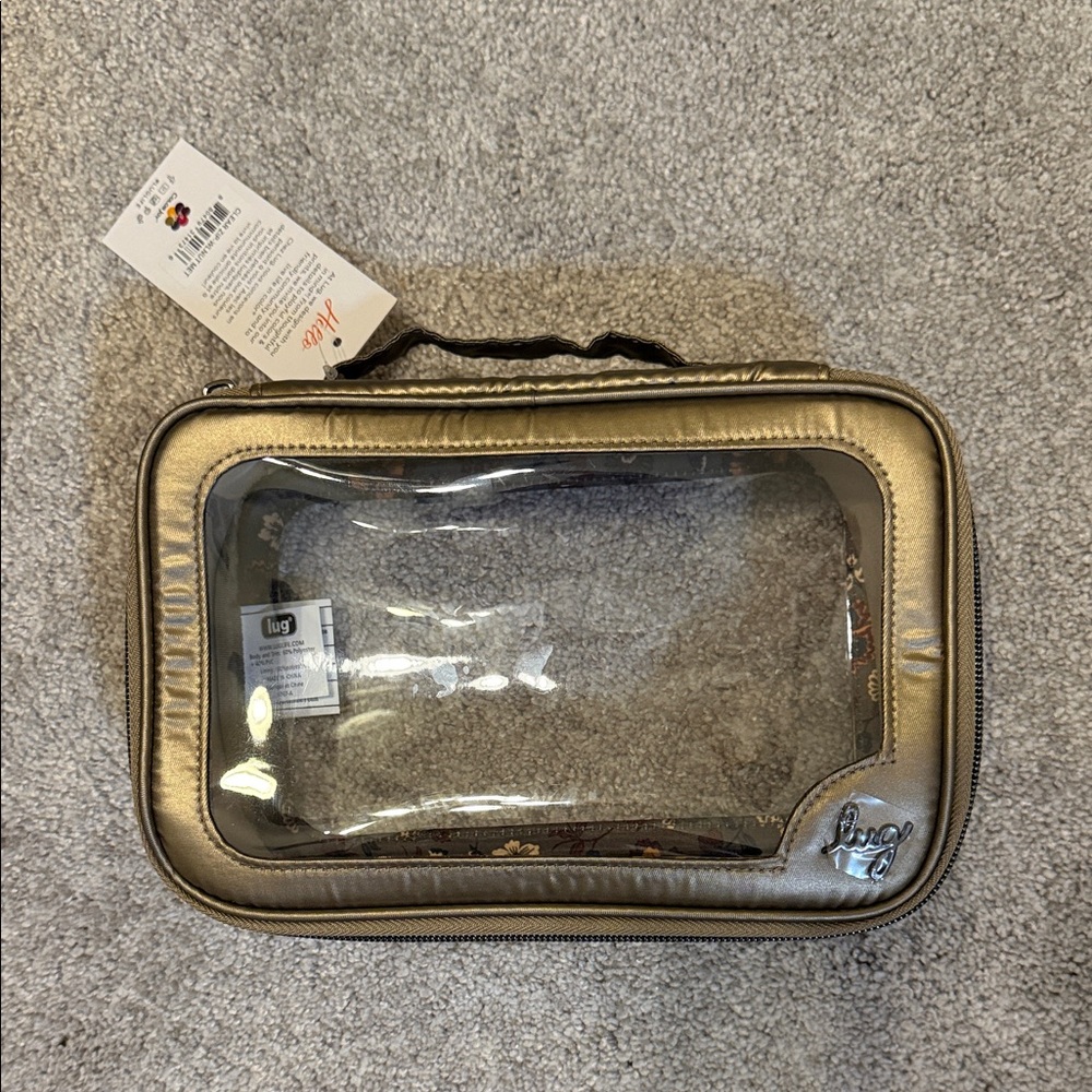 New. Lug. Clear zip storage. Metallic walnut with boho floral interior lining.